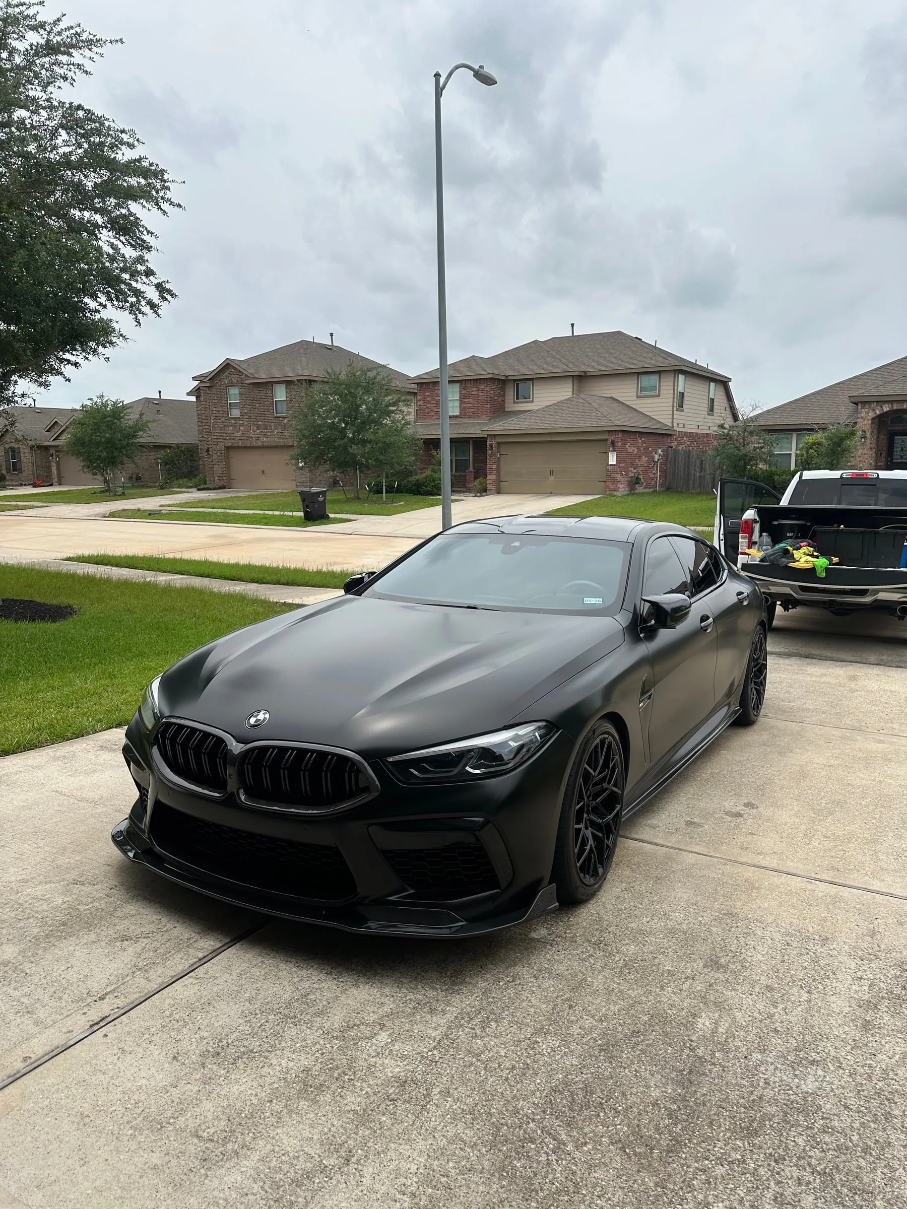 Gray BMW ceramic coated on-site during a mobile appointment