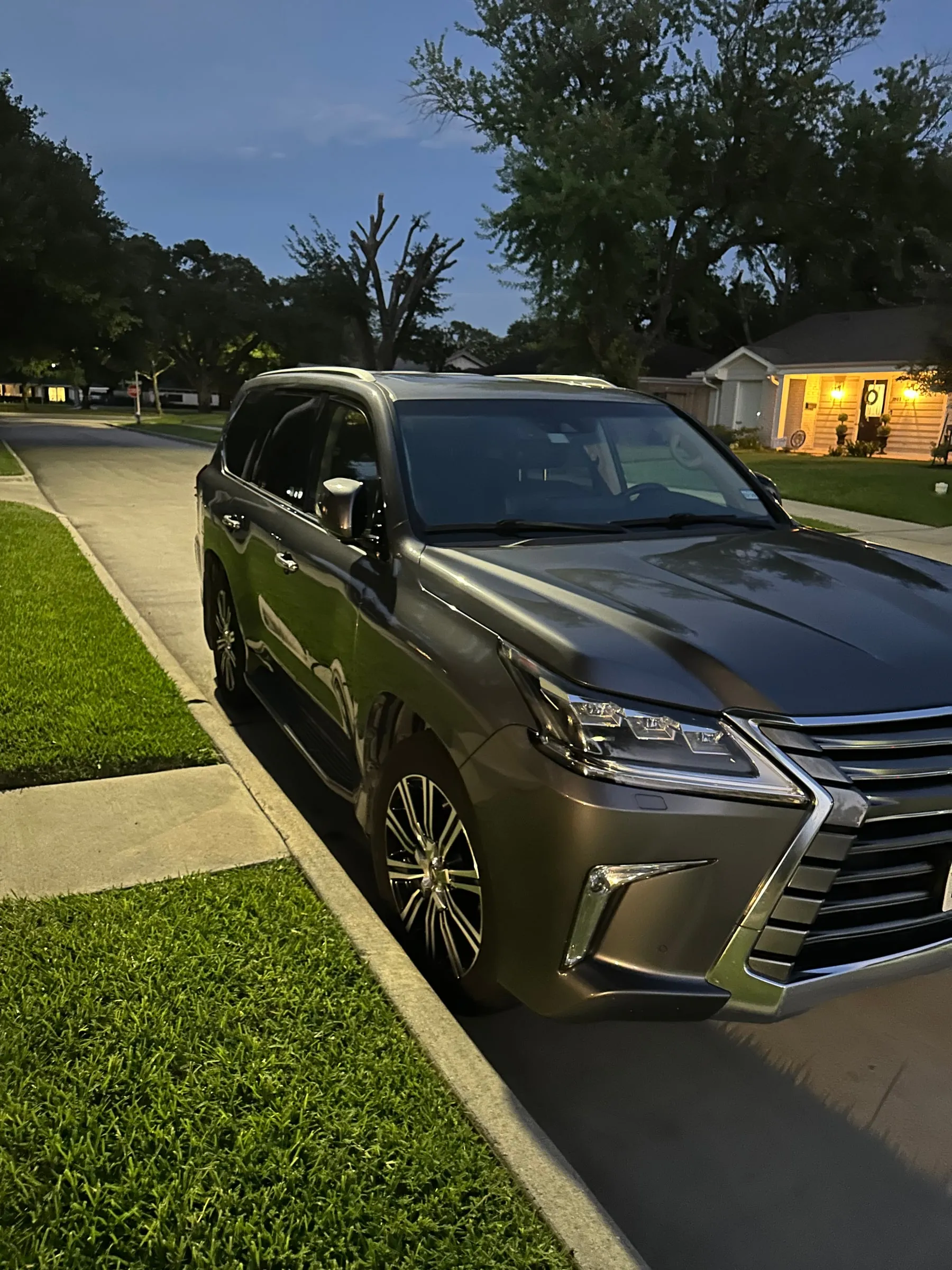 Luxury SUV detailed and ceramic coated at dusk