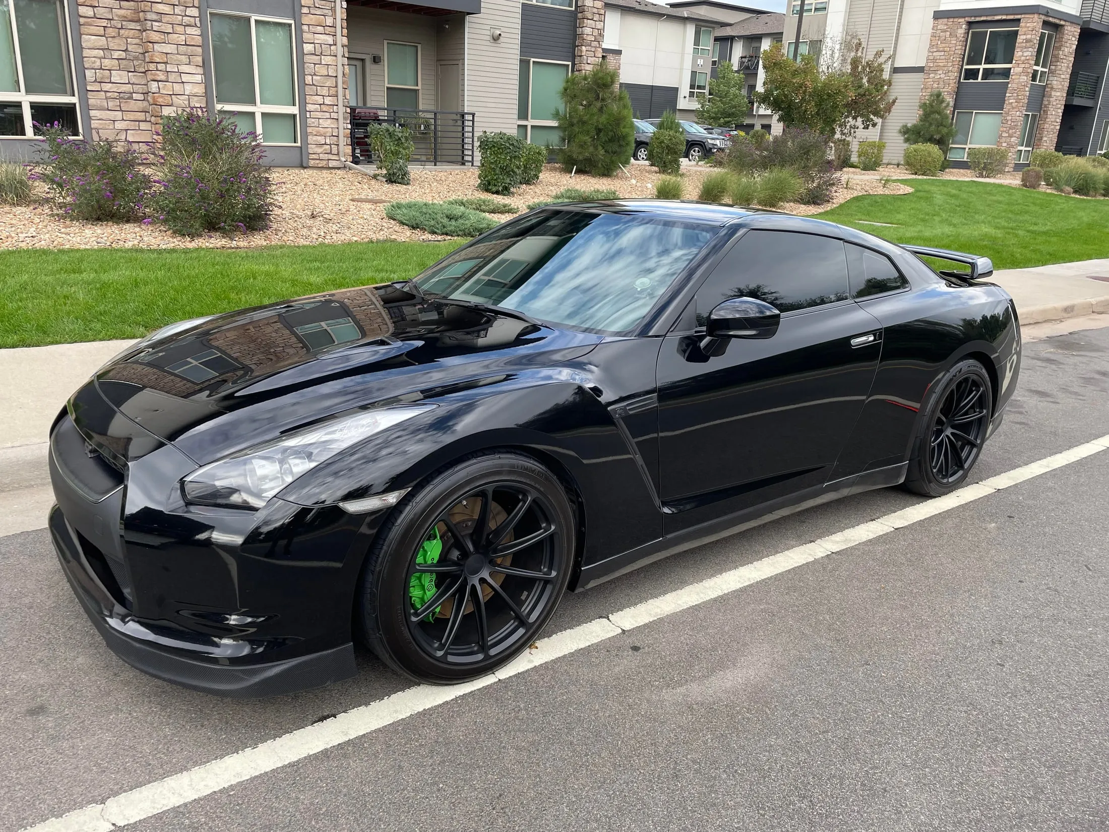 Glossy black sports car after a professional ceramic coating